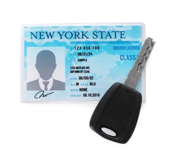 American driving license and car key on white background, top view