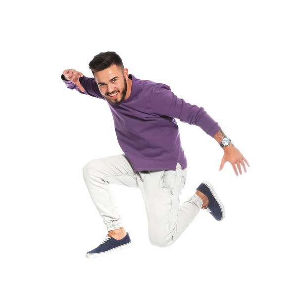 ハンサムな若い男の白い背景の上にジャンプ — ストック写真