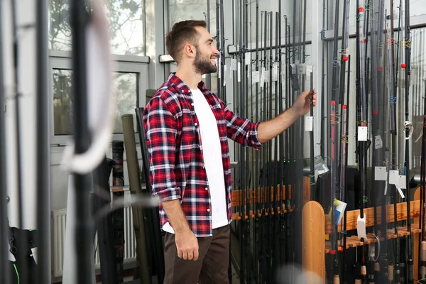 Man Choosing Fishing Rod Sports Shop — Stock Photo, Image