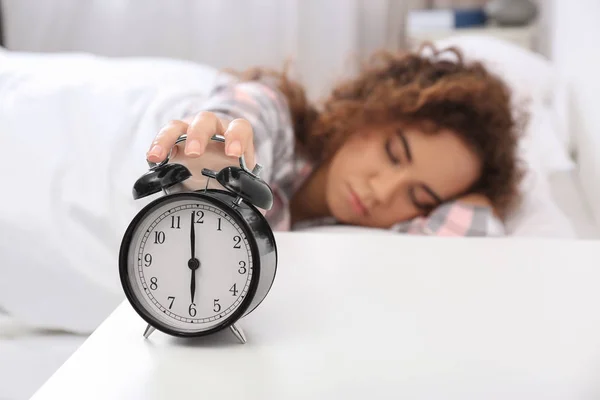 Young African American Woman Turning Alarm Clock Home Bedtime — Stock Photo, Image