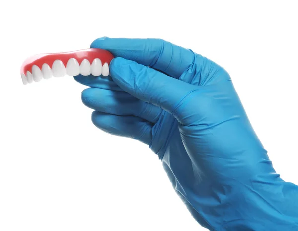 Dentist holding teeth cover on white background