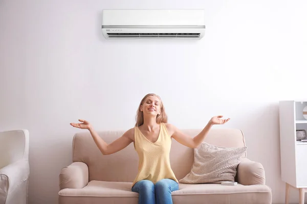 Young Woman Relaxing Air Conditioner Home — Stock Photo, Image
