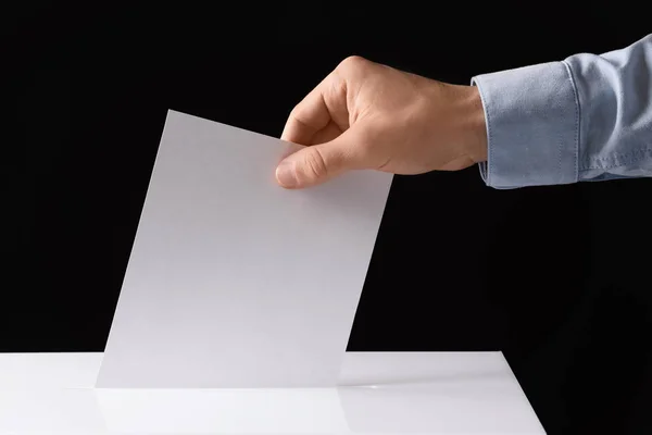 Man Putting His Vote Ballot Box Black Background Closeup — Stock Photo, Image