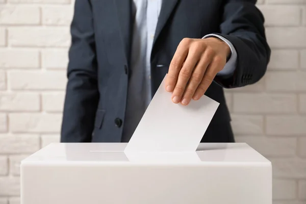 Man Putting His Vote Ballot Box Brick Wall Closeup — Stock Photo, Image