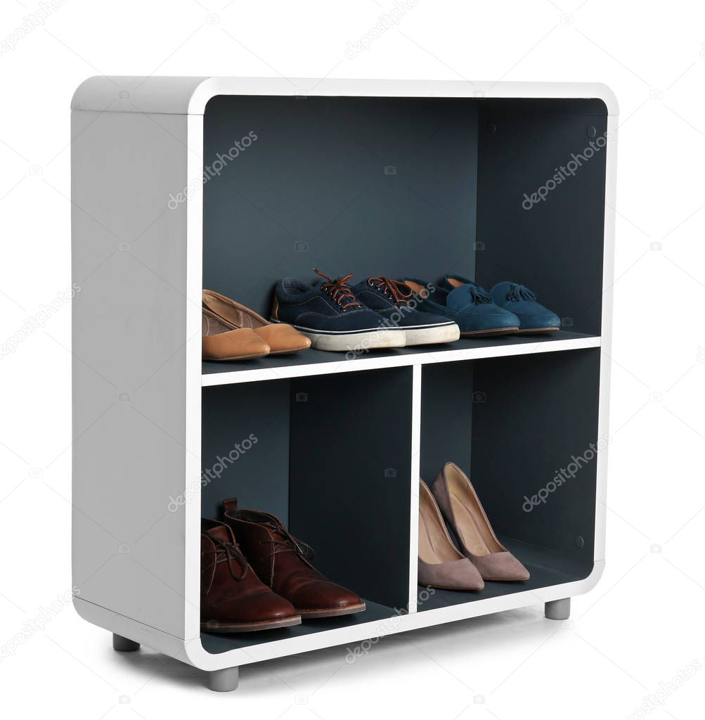 Stylish shelving unit with shoes on white background. Furniture for wardrobe room
