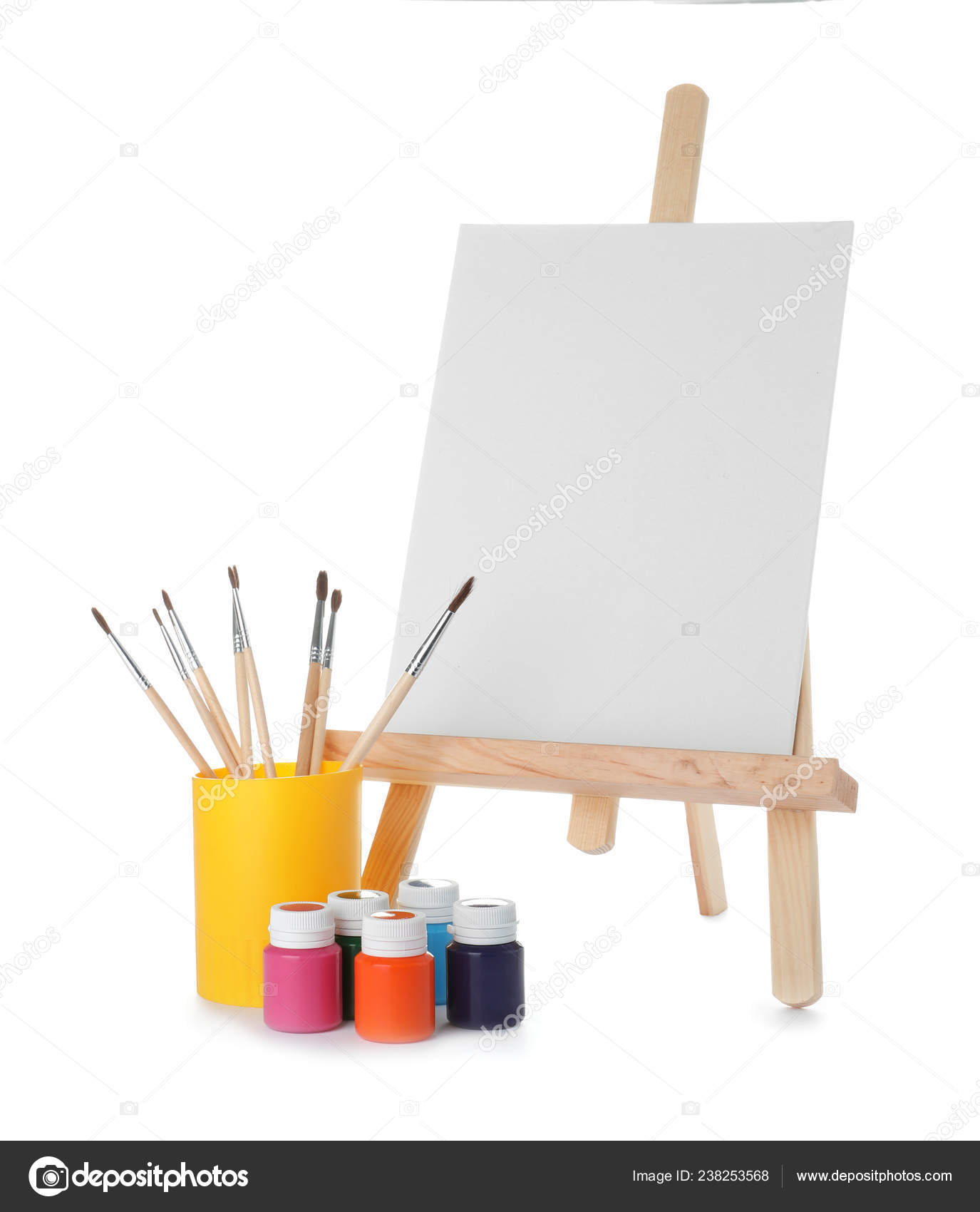 Wooden easel with blank canvas on white background