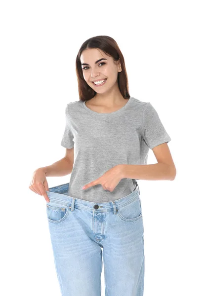 Smal Kvinna Överdimensionerade Jeans Vit Bakgrund Viktminskning — Stockfoto