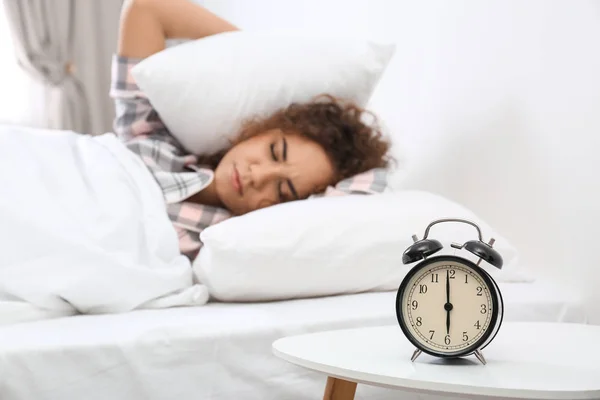 Young African American Woman Covering Ears Pillows While Hiding Alarm — Stock Photo, Image