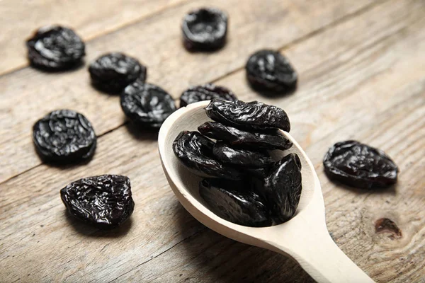 Spoon Dried Plums Wooden Background Closeup Healthy Fruit — Stock Fotó