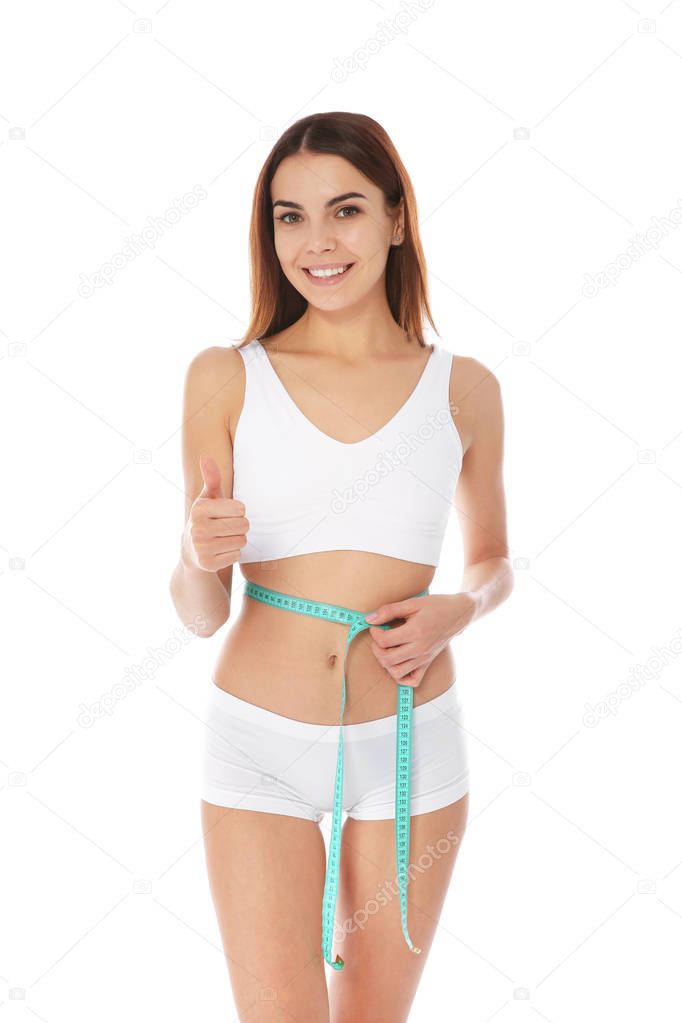 Slim woman measuring her waist on white background. Weight loss