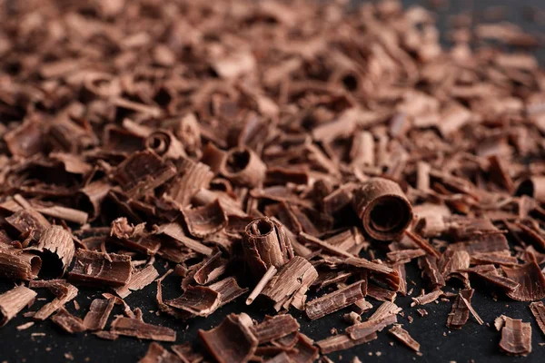 Montón Sabrosos Rizos Chocolate Sobre Fondo Negro Primer Plano — Foto de Stock