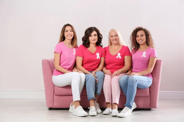 Group Women Silk Ribbons Sofa Light Wall Breast Cancer Awareness — Stock Photo, Image