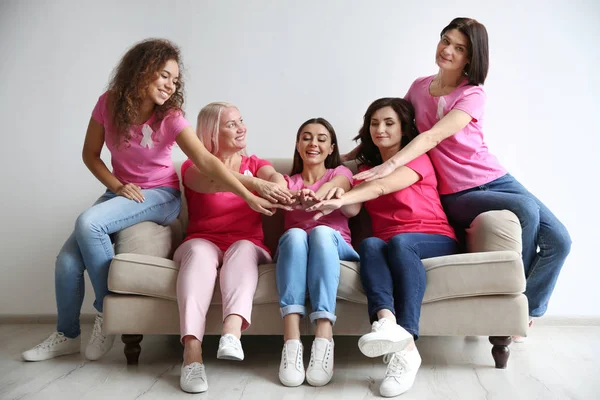 Group Women Silk Ribbons Joining Hands Sofa Light Wall Breast — Stock Photo, Image