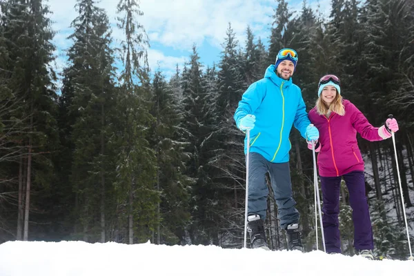 Happy Couple Ski Equipment Sitting Snowy Hill Mountains Space Text — Stock Photo, Image