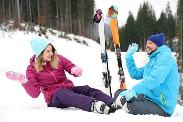 Happy Couple Ski Equipment Sitting Snowy Hill Mountains Space Text — Stockfoto