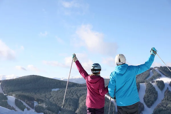 Happy Couple Ski Equipment Sitting Snowy Hill Mountains Space Text — Stockfoto