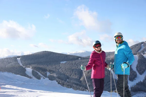 Happy Couple Ski Equipment Sitting Snowy Hill Mountains Space Text — Stok fotoğraf