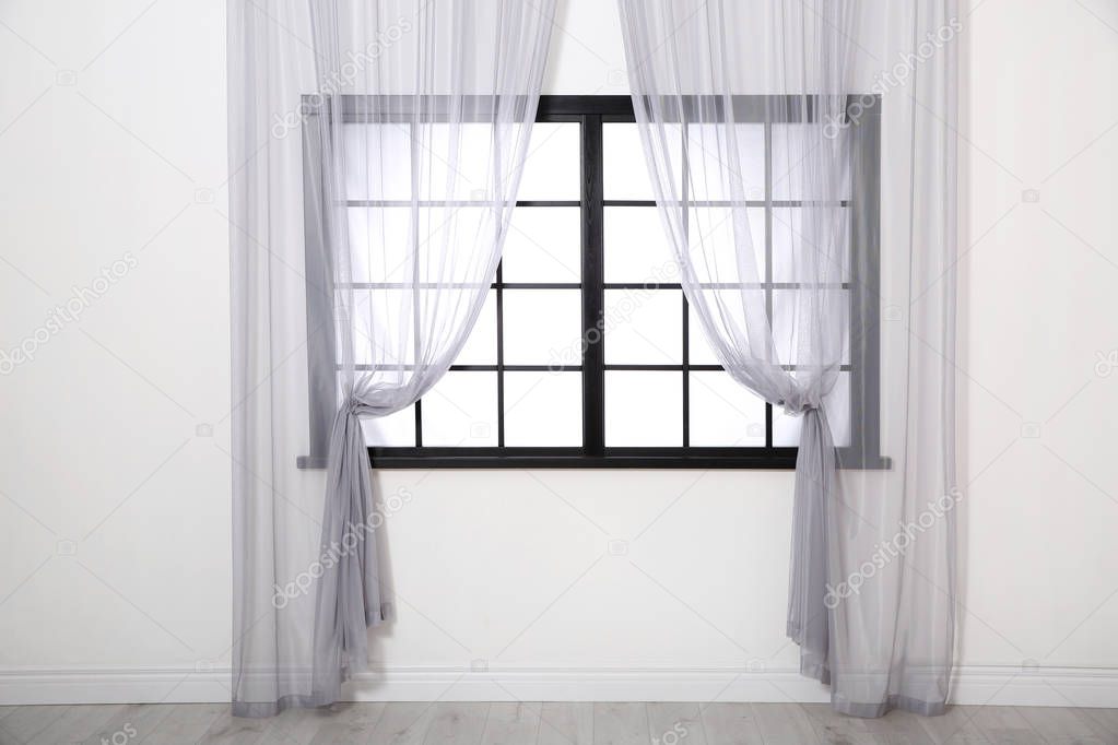 Modern window with glass and curtains in room. Home interior