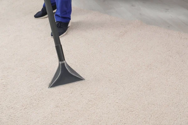 Man Removing Dirt Carpet Vacuum Cleaner Indoors Closeup Space Text — Stock Photo, Image