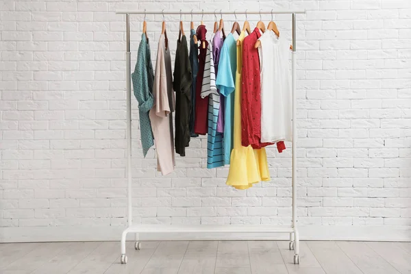 Wardrobe Rack Stylish Clothes Brick Wall Indoors — Stock Photo, Image