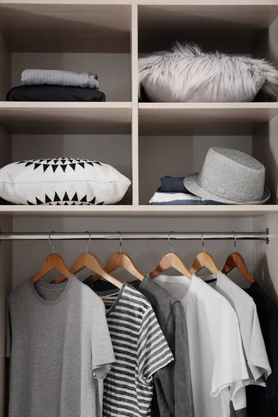 Stylish clothes and home stuff in large wardrobe closet