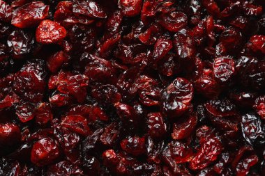 Arka plan, üstten görünüm olarak lezzetli kızılcık. Kurutulmuş meyve sağlıklı çerez olarak