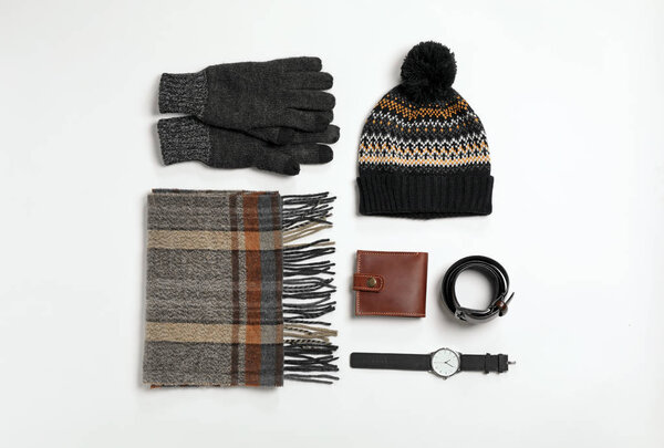 Flat lay composition with male winter clothes on white background