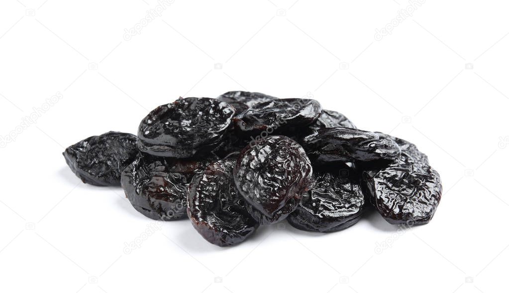 Heap of tasty prunes on white background. Dried fruit as healthy snack