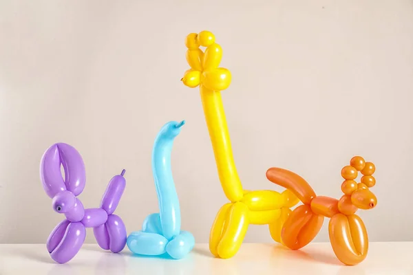 Animal Figures Made Modelling Balloons Table Color Background — Stock Photo, Image