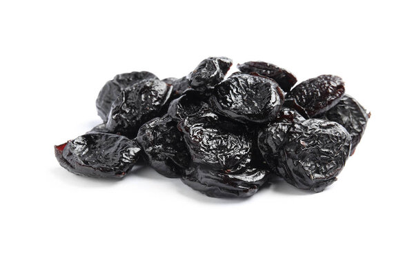Heap of tasty prunes on white background. Dried fruit as healthy snack