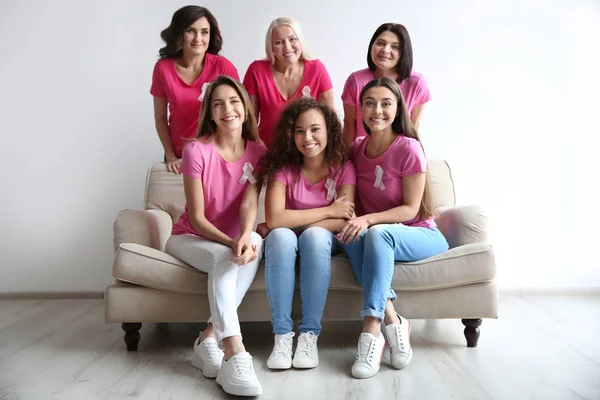 Group Women Silk Ribbons Sitting Sofa Light Wall Breast Cancer — Stock Photo, Image