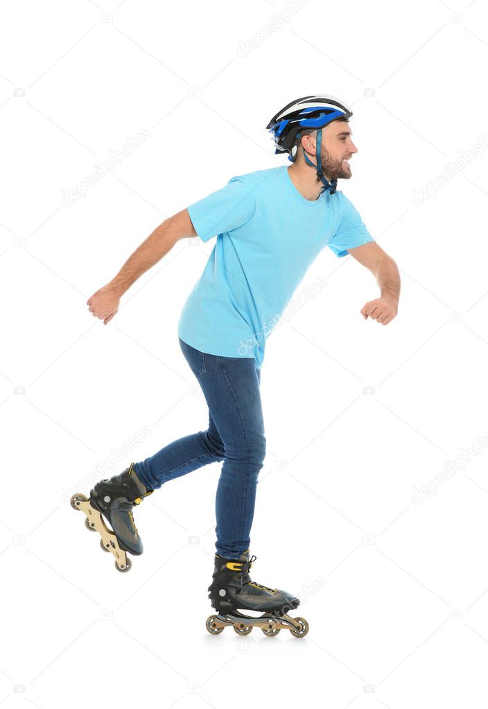 Young man with inline roller skates on white background