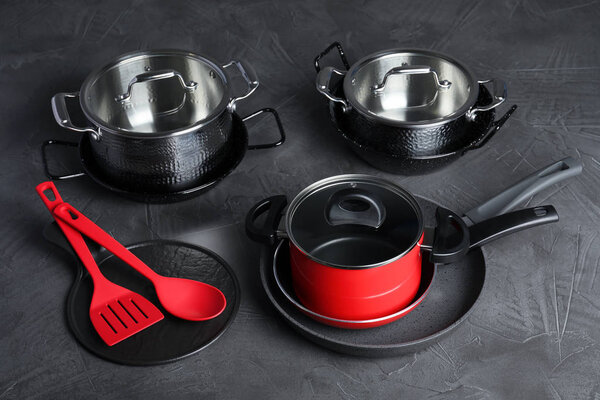 Set of modern clean kitchenware on color background