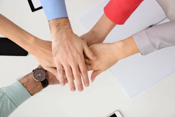 Young People Holding Hands Together Table Top View Team Victory — Stock Photo, Image