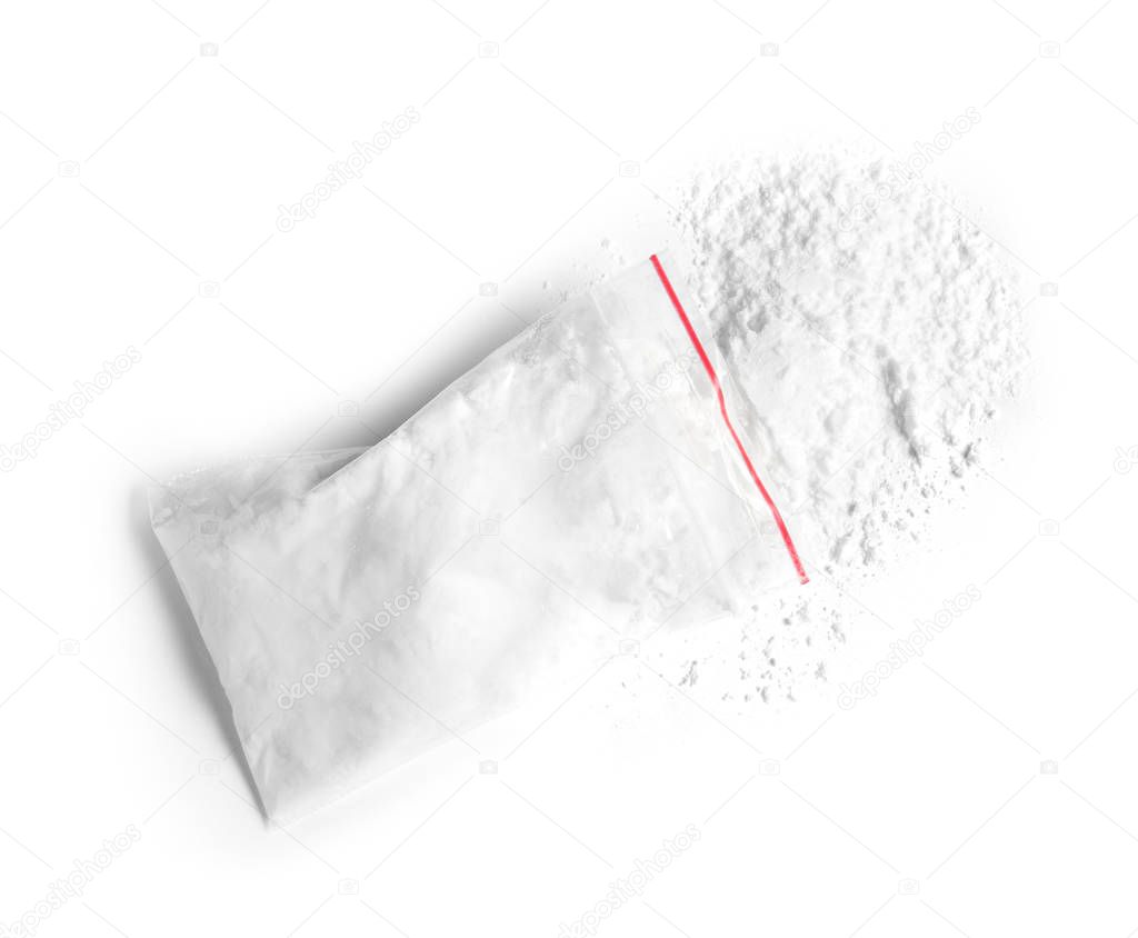 Cocaine in plastic bag on white background, top view