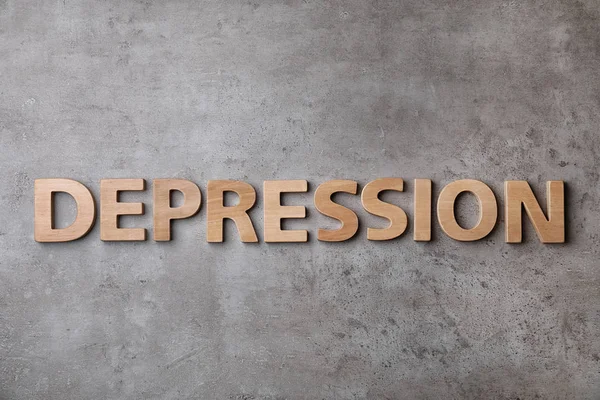 Λέξη Κατάθλιψη Από Ξύλινες Επιστολές Γκρίζο Φόντο Top View — Φωτογραφία Αρχείου