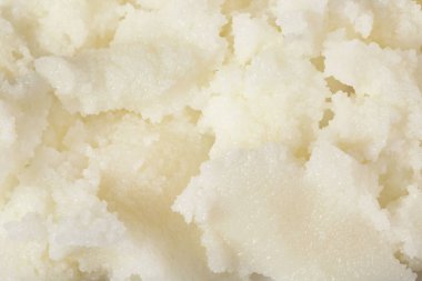 Arka plan, üstten görünüm olarak taze shea yağı. Kozmetik ürün