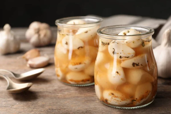 Preserved Garlic Glass Jars Wooden Table Closeup Space Text — Stock Photo, Image