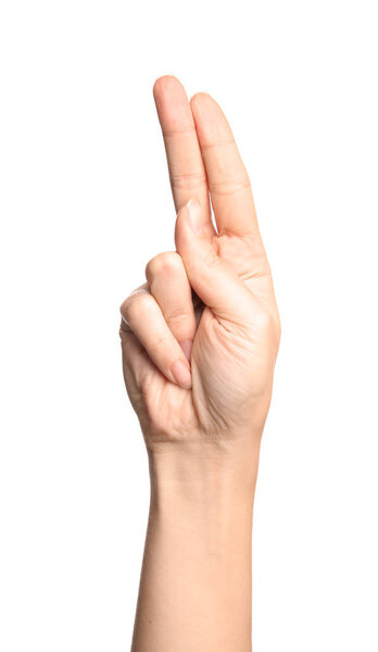 Woman showing U letter on white background, closeup. Sign language