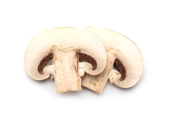 Slices of fresh champignon mushrooms on white background, top view