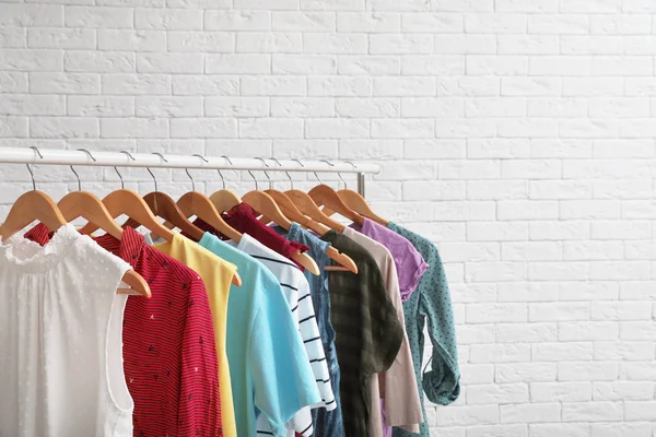 Wardrobe Rack Stylish Clothes Brick Wall Indoors Space Text — Stock Photo, Image