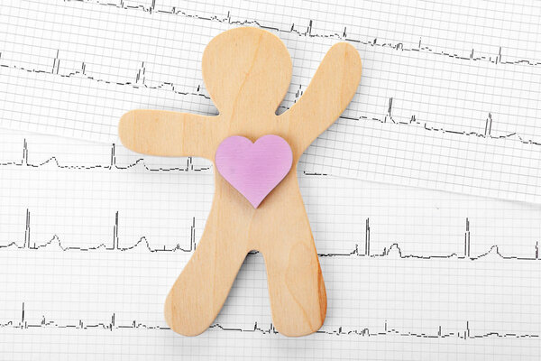 Human figure with heart on cardiogram, top view