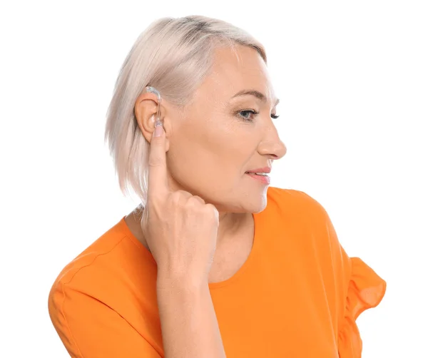 Mature Woman Adjusting Hearing Aid White Background — Stock Photo, Image