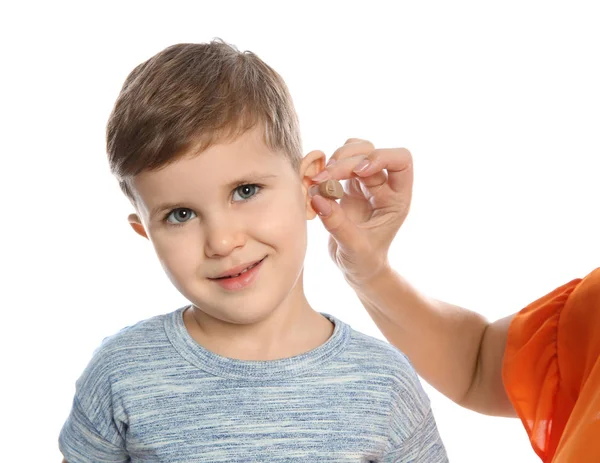 Mature Woman Putting Hearing Aid Little Grandson Ear White Background — Stock Photo, Image