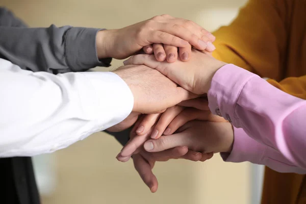 Young People Putting Hands Together Blurred Background Closeup — Stock Photo, Image