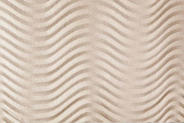 Zen garden pattern on sand as background, top view. Meditation and harmony
