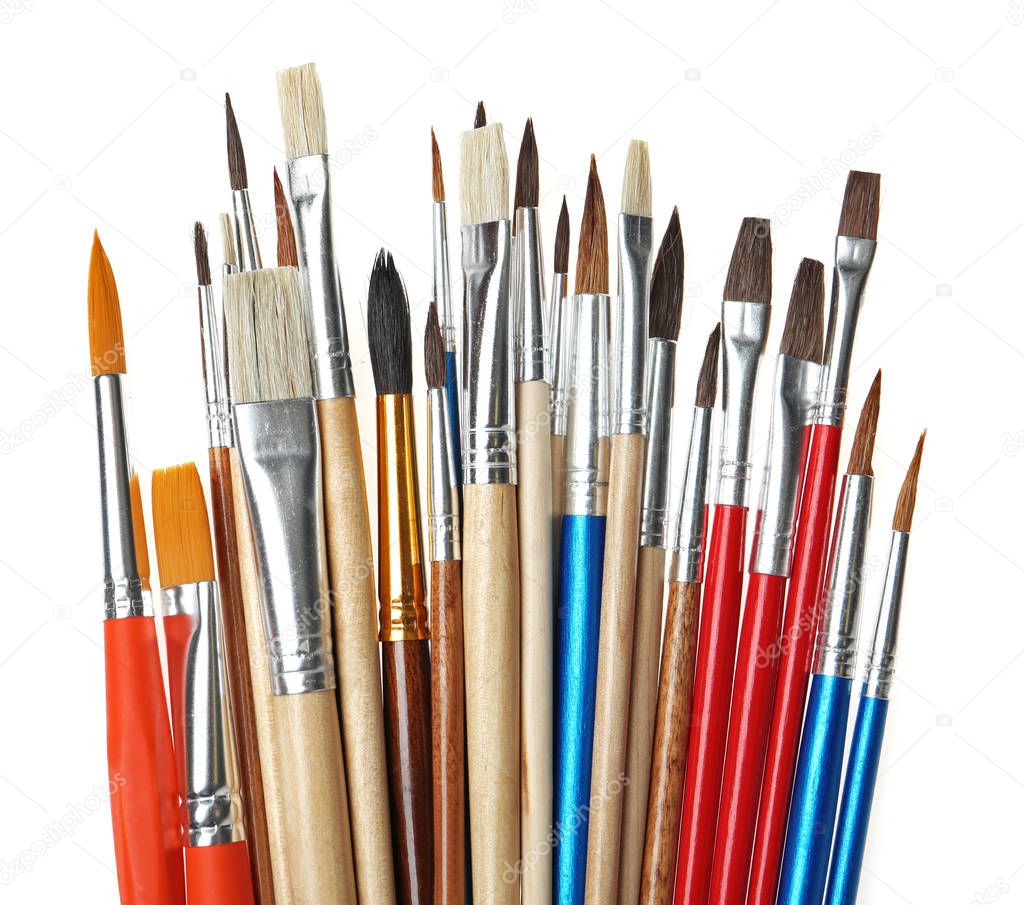 Set of different paint brushes on white background