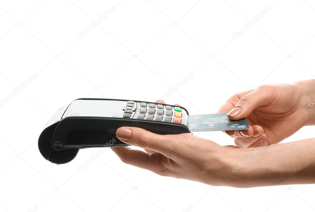 Woman using payment terminal on white background, closeup