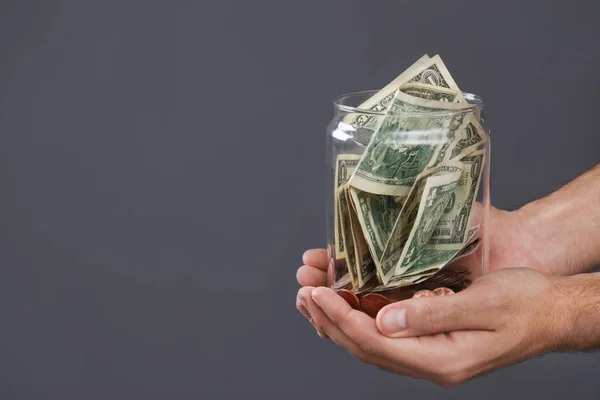 Man Holding Donation Jar Money Grey Background Closeup Space Text — Stock Photo, Image