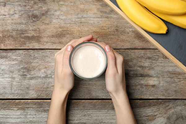 Woman Holding Glass Healthy Protein Shake Bananas Wooden Table Top — Stock Photo, Image